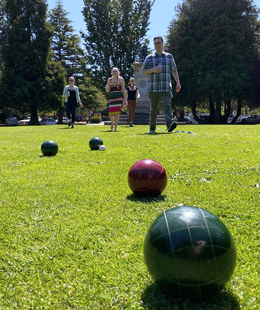 Leap team members play bocce in the park.