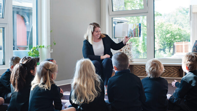 A teacher instructs a group of students.