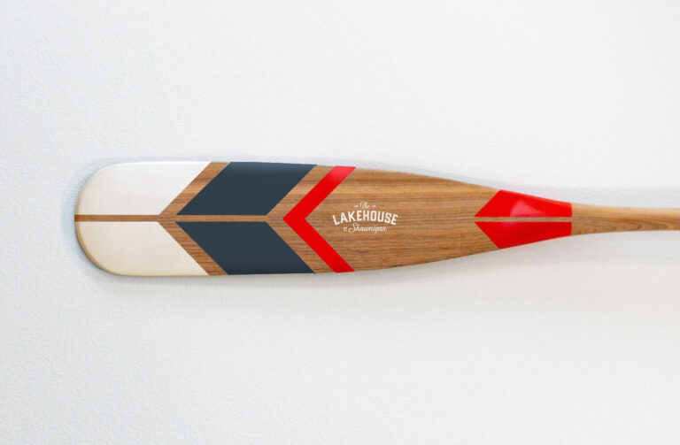 A paddle with The Lakehouse at Shawnigan on it.