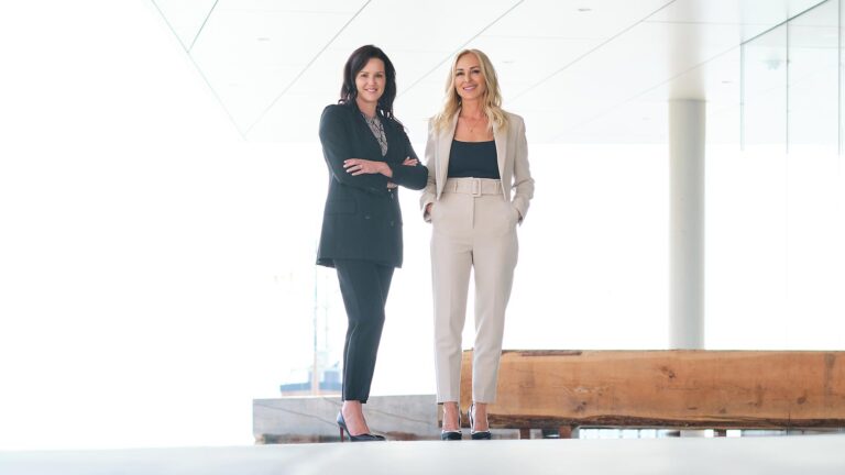 Two of the LUX Skin Lab team members pose for a photo.